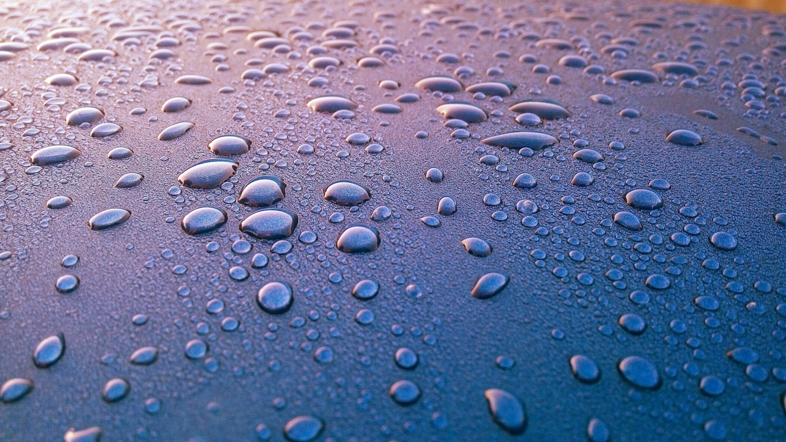 Home Close-up of water droplets on a surface, perfect for 4k mobile wallpapers.
